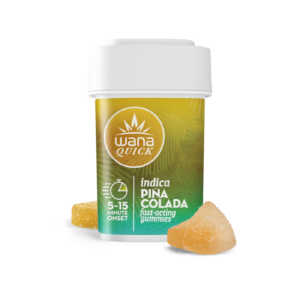 Wana Quick Indica Pina Colada gummies container with two sugar-coated gummies beside it, offering fast-acting effects in 5-15 minutes.