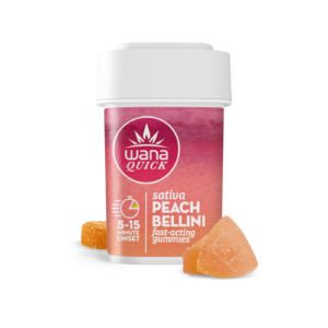 Wana Quick Sativa Peach Bellini gummies container with two peach-colored gummies beside it.